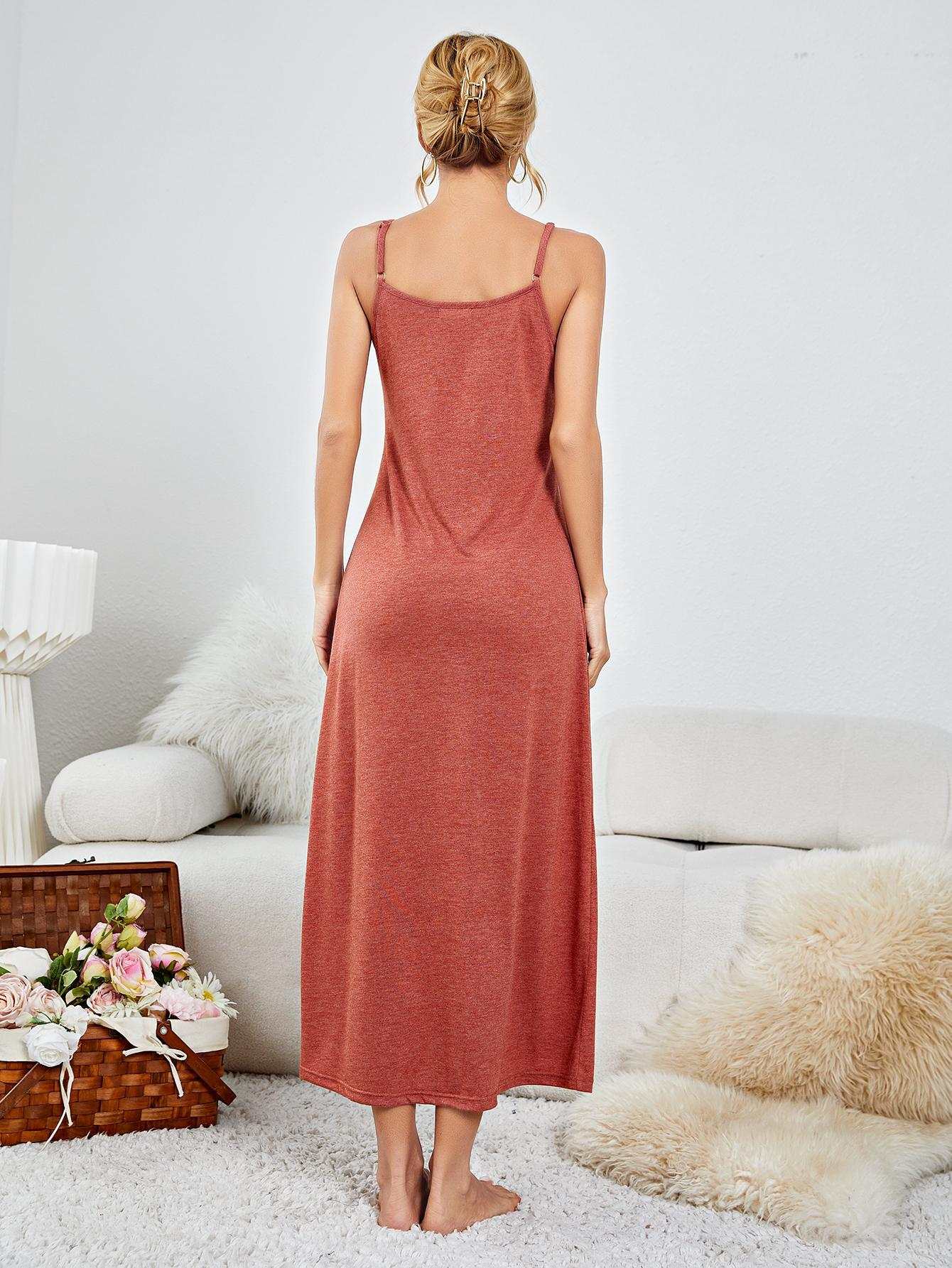 Minimalist scoop neck spaghetti strap night dress in solid color, sleeveless design, studio setting.