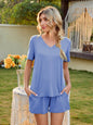 V-Neck Short Sleeve Top and Pocketed Shorts Lounge Set in blue, two-piece, slightly stretchy polyester fabric.