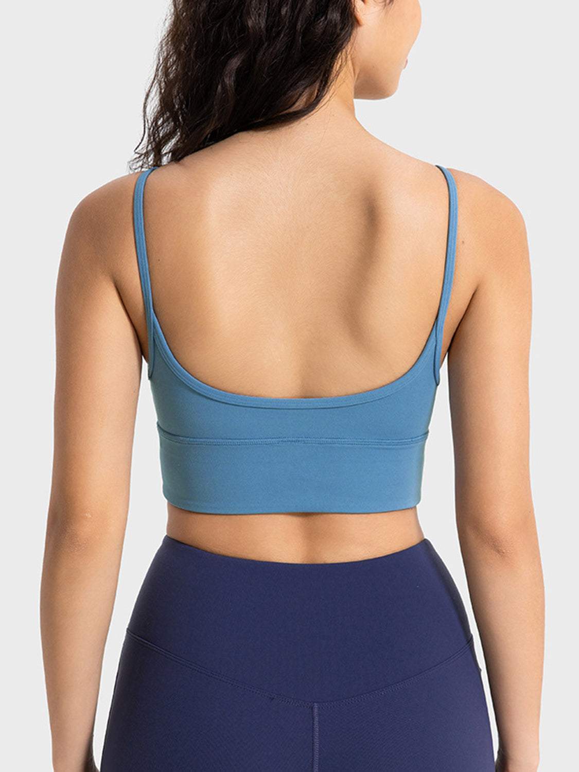 Millennia Spaghetti Strap Sport Bra in blue, featuring a basic style with stretchy nylon-spandex fabric.