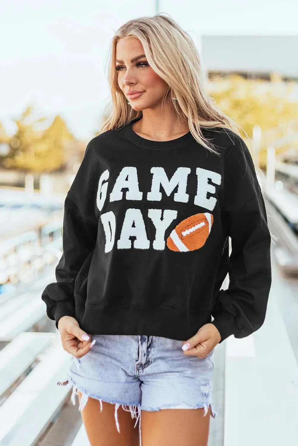 GAME DAY round neck long sleeve sweatshirt, black, worn by model, casual wear.