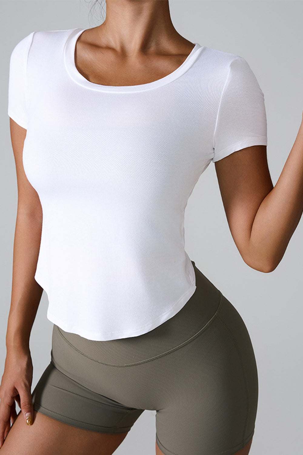 White cutout round neck short sleeve active t-shirt.