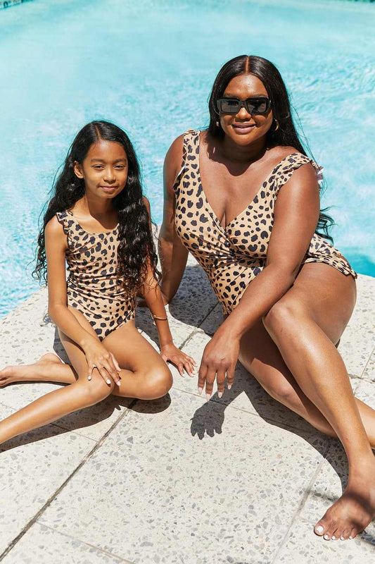 Leopard print ruffle faux wrap one-piece swimsuit by Marina West Swim, worn poolside.