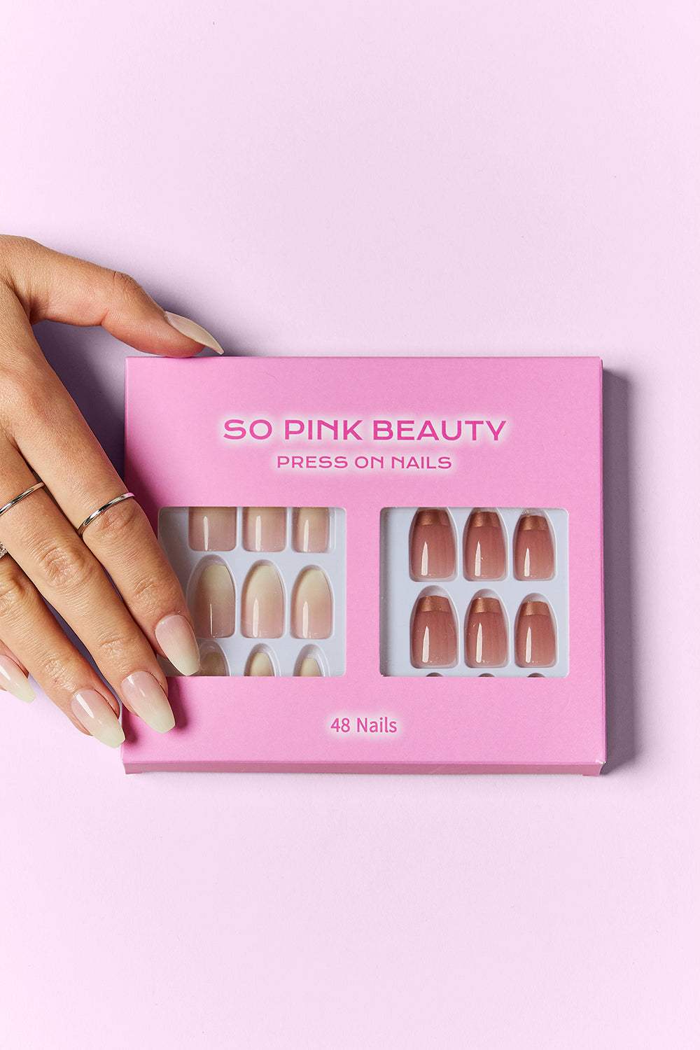 SO PINK BEAUTY Press On Nails 2 Packs with pink nail designs and application materials.