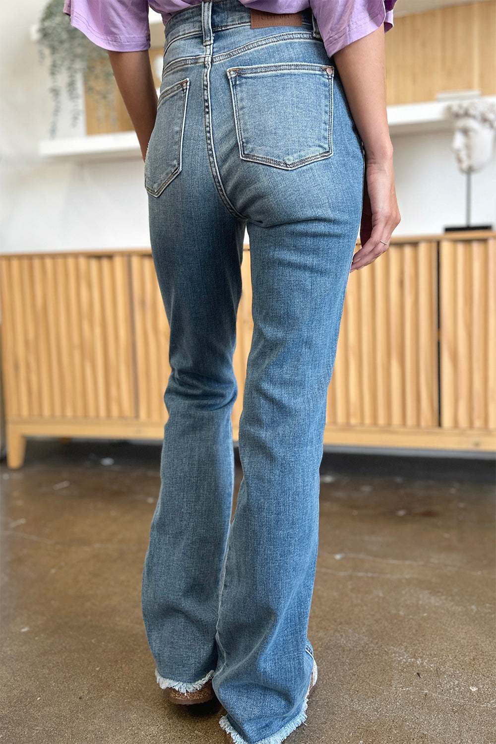 Judy Blue full size distressed raw hem bootcut jeans, high-quality denim.