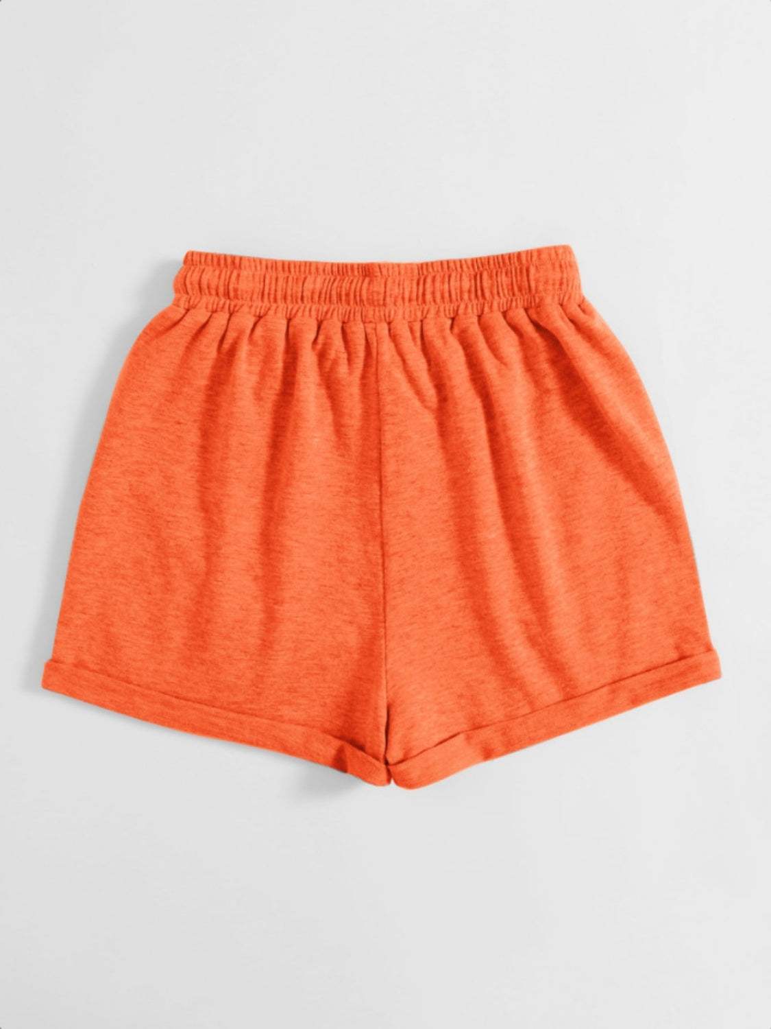 Orange drawstring pocketed elastic waist shorts made of 100% polyester.