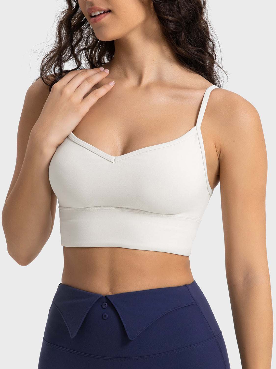 Millennia Spaghetti Strap Sport Bra in white with removable padding and stretchy fit.