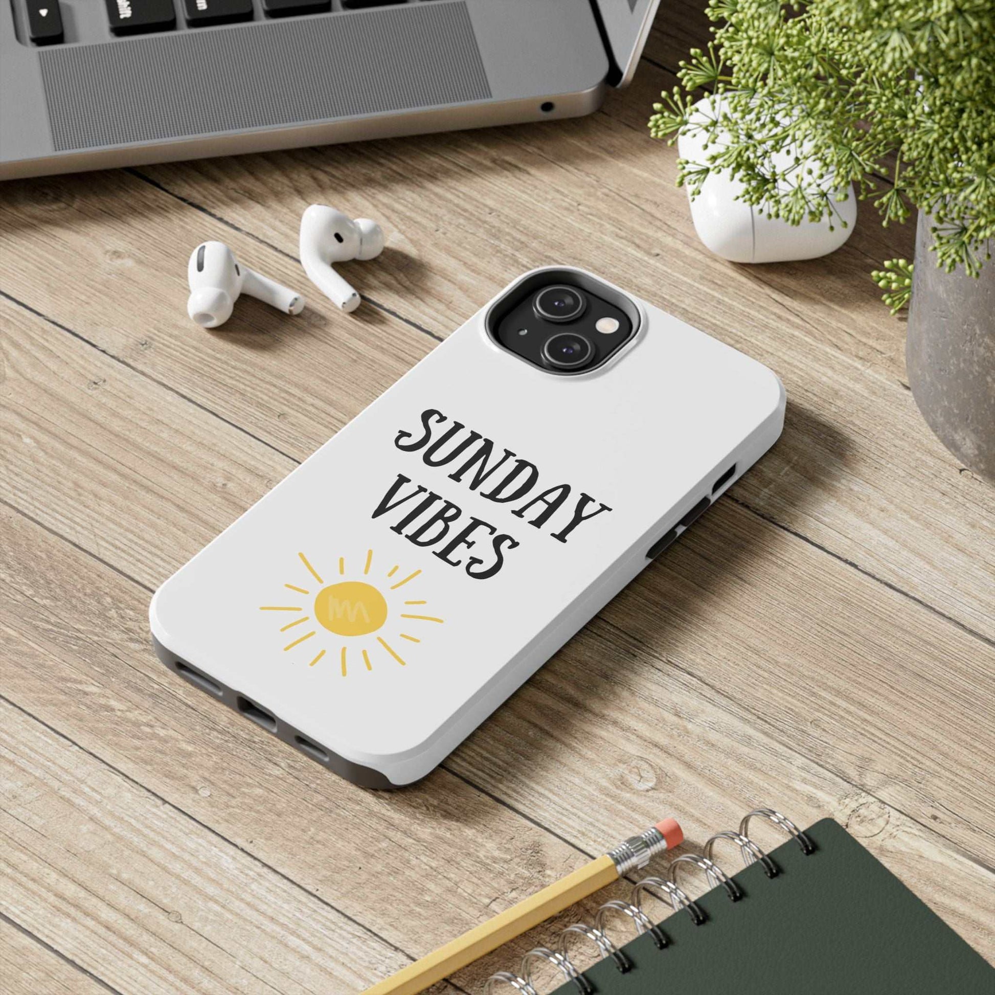 Phone case with 'Sunday Vibes' sun graphic design on a smartphone, showcasing durable Lexan plastic and glossy finish.