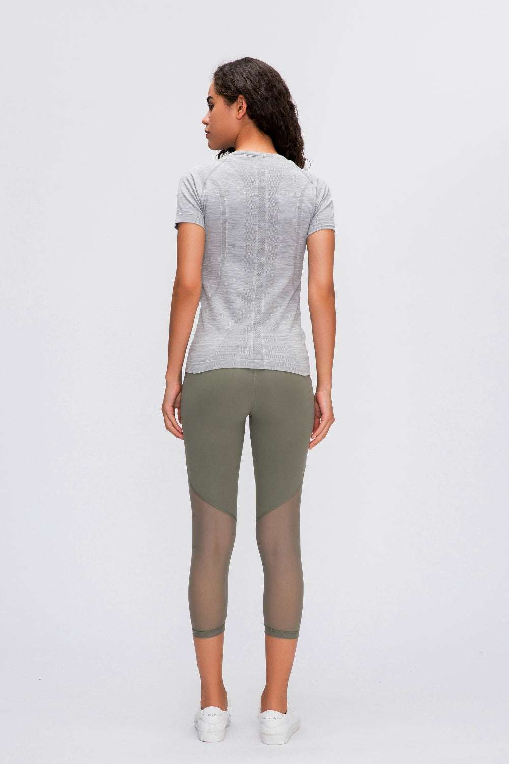 Millennia Round Neck Short Sleeve Active T-Shirt in gray worn by model, back view.