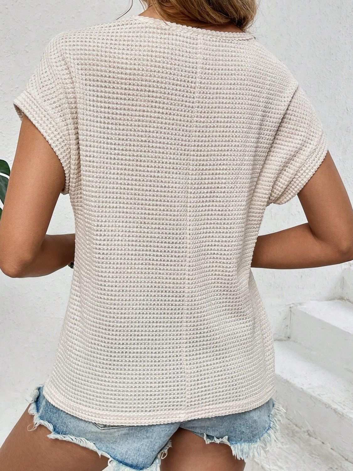 Waffle-knit round neck short sleeve top with lace detail in beige.