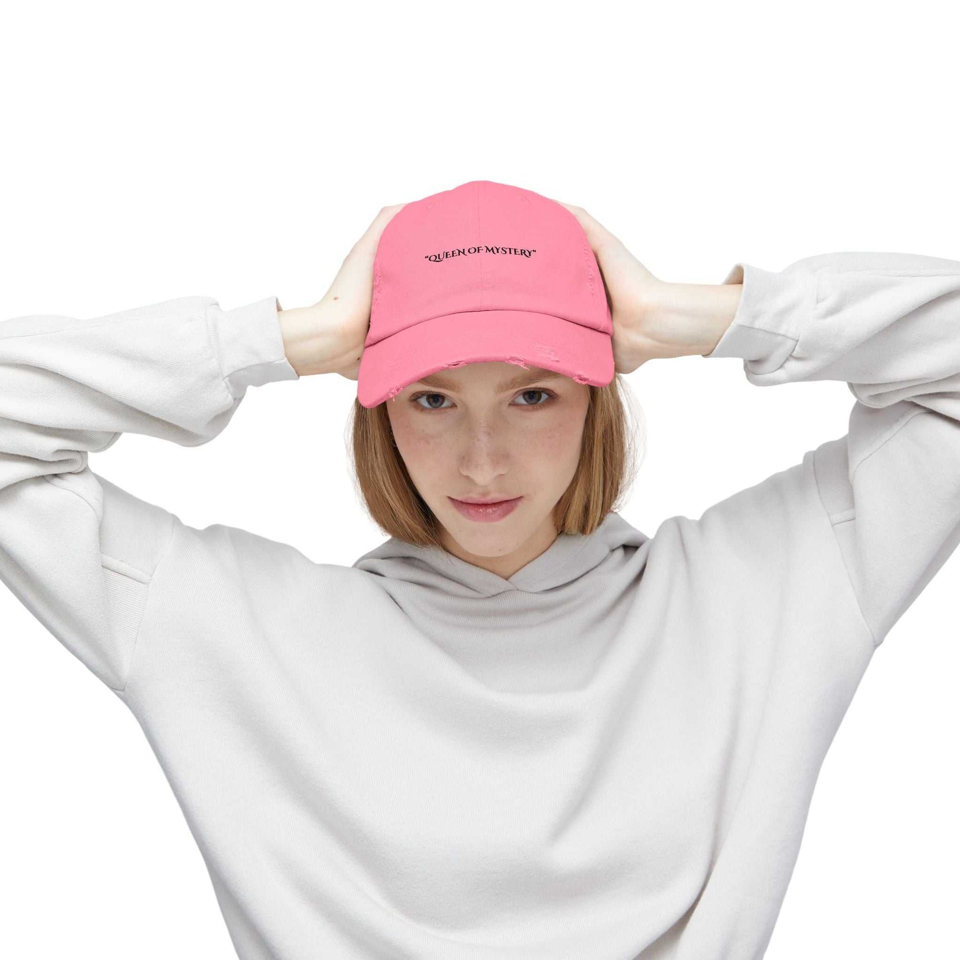 Distressed pink cap with "Queen of Mystery" text, Securing Secrets Brand, vintage and mysterious vibe.