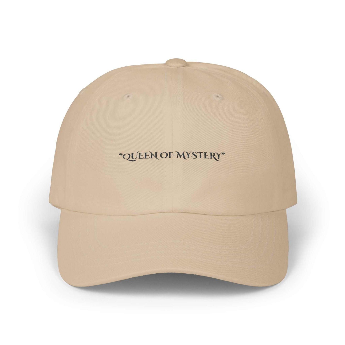 Classic Dad Cap with "Queen of Mystery" text, beige color, 6-panel structure, precurved visor, adjustable snap closure.