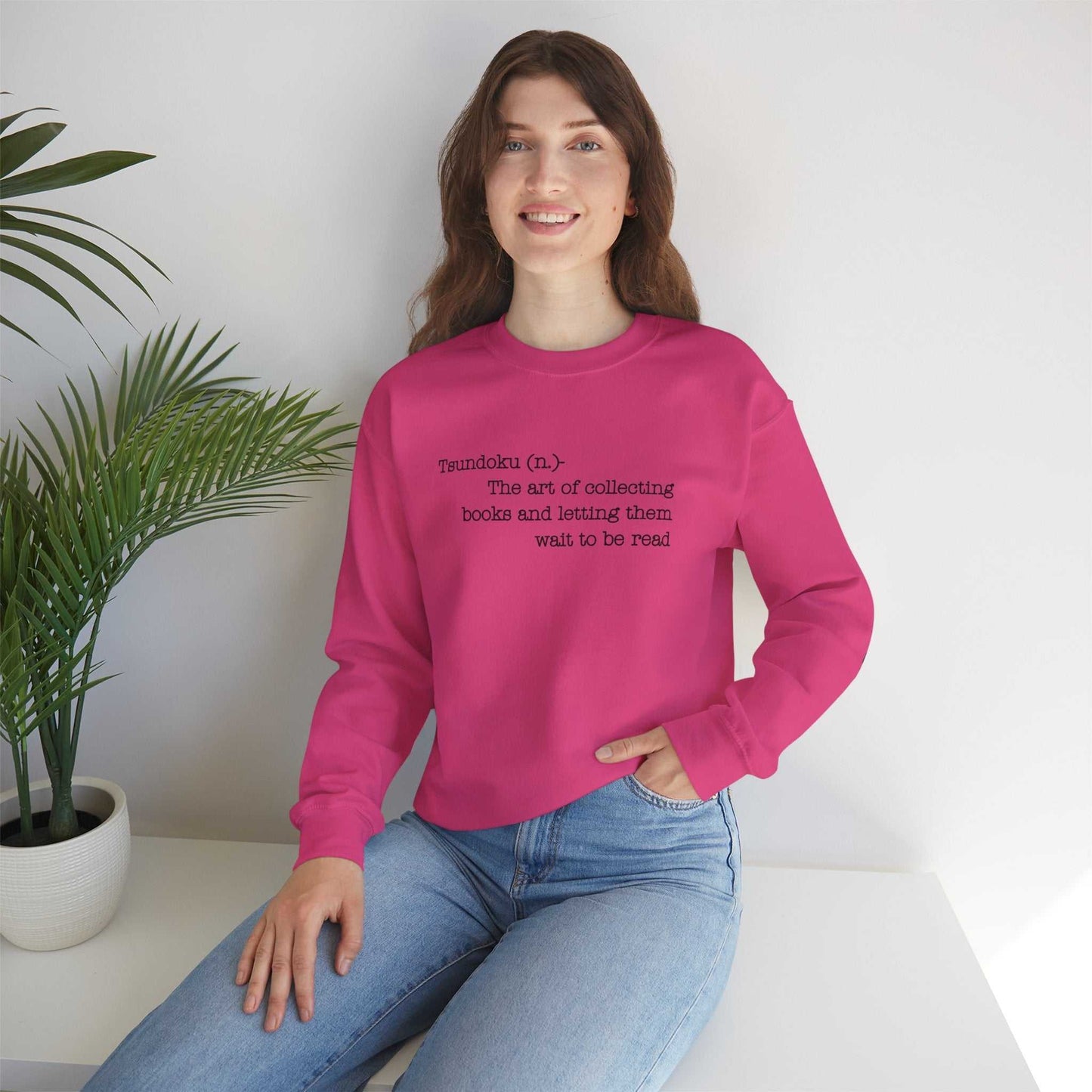 "T. B. R. Tsundoku" crewneck sweatshirt featuring book-inspired definition, worn by a person.