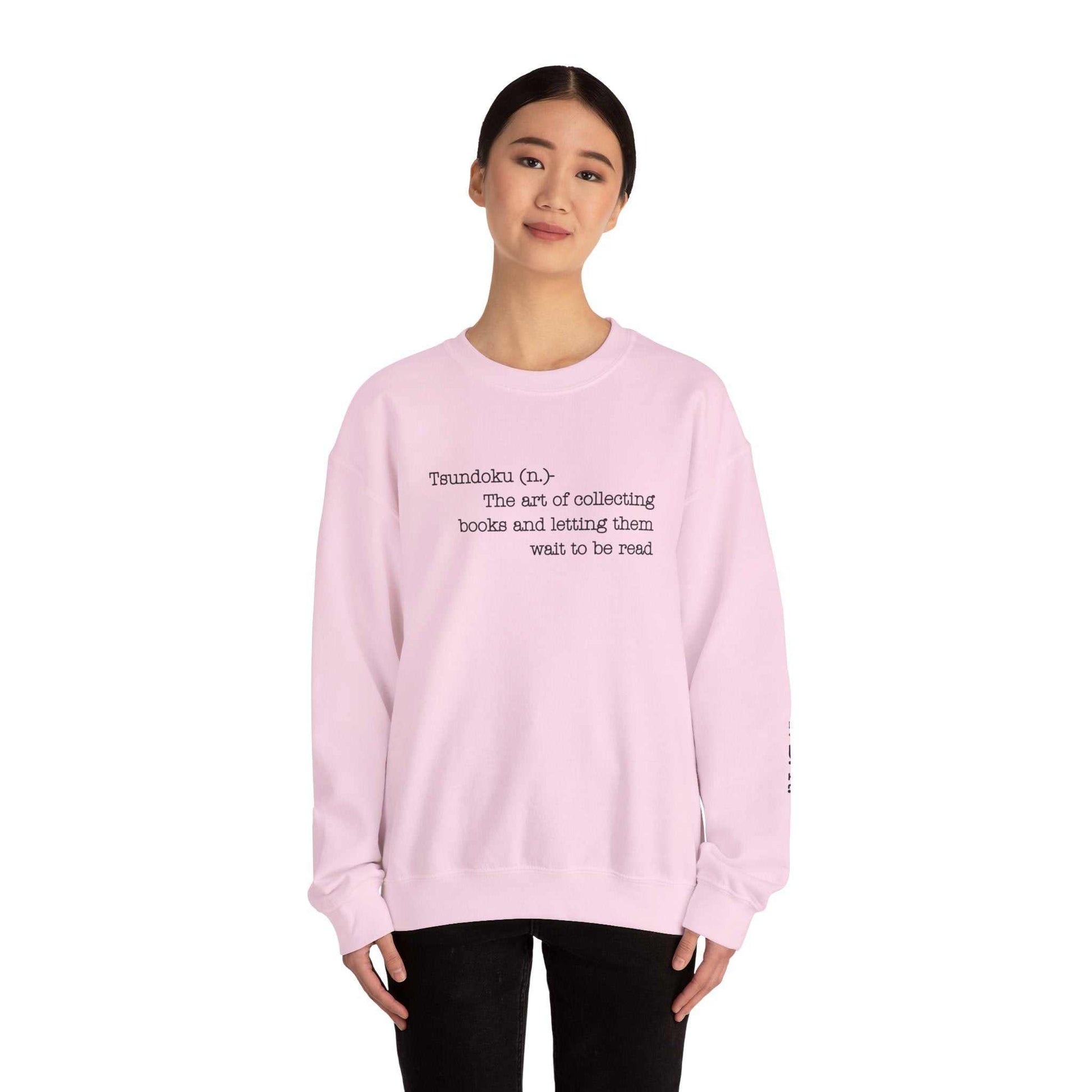 Tsundoku crewneck sweatshirt featuring book collecting definition on front, ideal for avid readers.