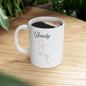 Ceramic mug with "Beauty" text and dusty rose design, ideal for gifts and hot beverages.