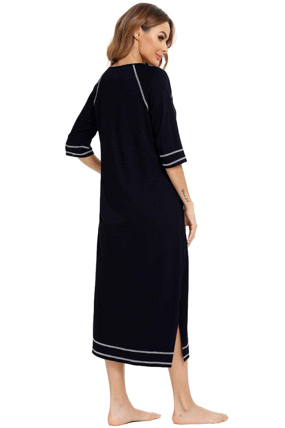 Women's black zip-up night dress with slit, round neck, and pockets.