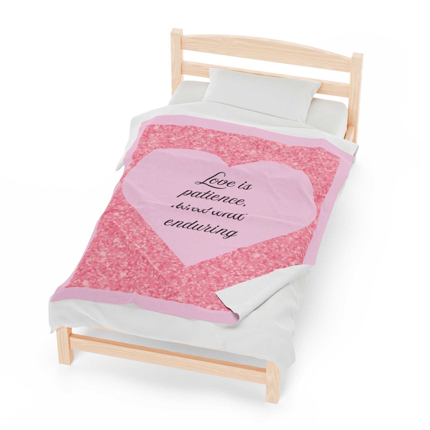 Plush blanket with pink heart and glitter design, featuring the quote "Love is patience, kind and enduring."