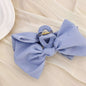 Blue polyester bow hair claw clip, 5.1 inches, 1.4 oz.