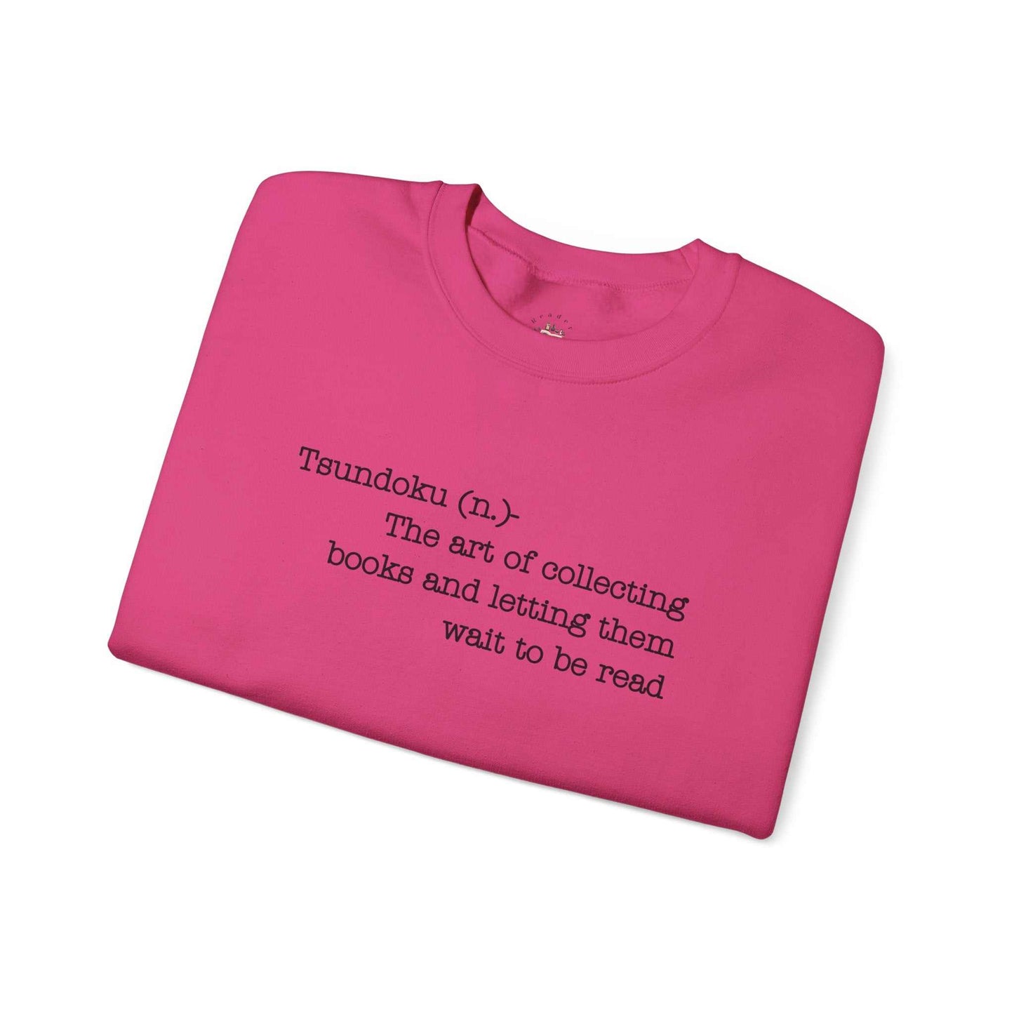 Pink "T. B. R. Tsundoku" crewneck sweatshirt with book definition text for avid readers.