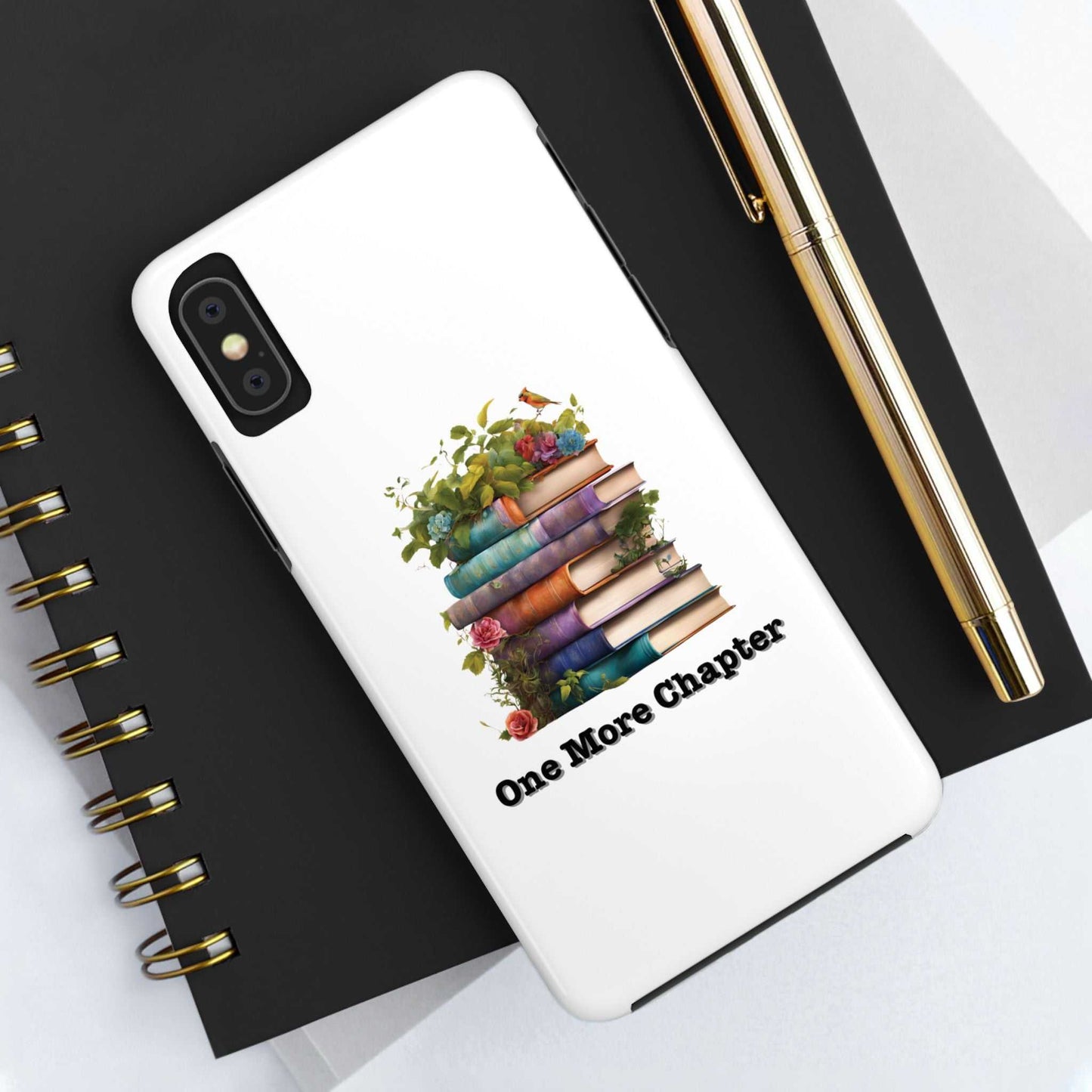 Phone case with a "One More Chapter" book pile design, perfect for book lovers; durable and stylish protection.