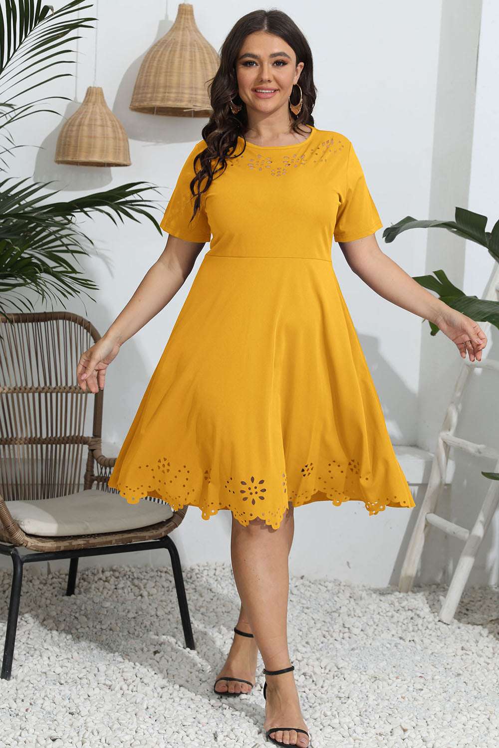 Plus size round neck openwork dress in yellow with short sleeves.