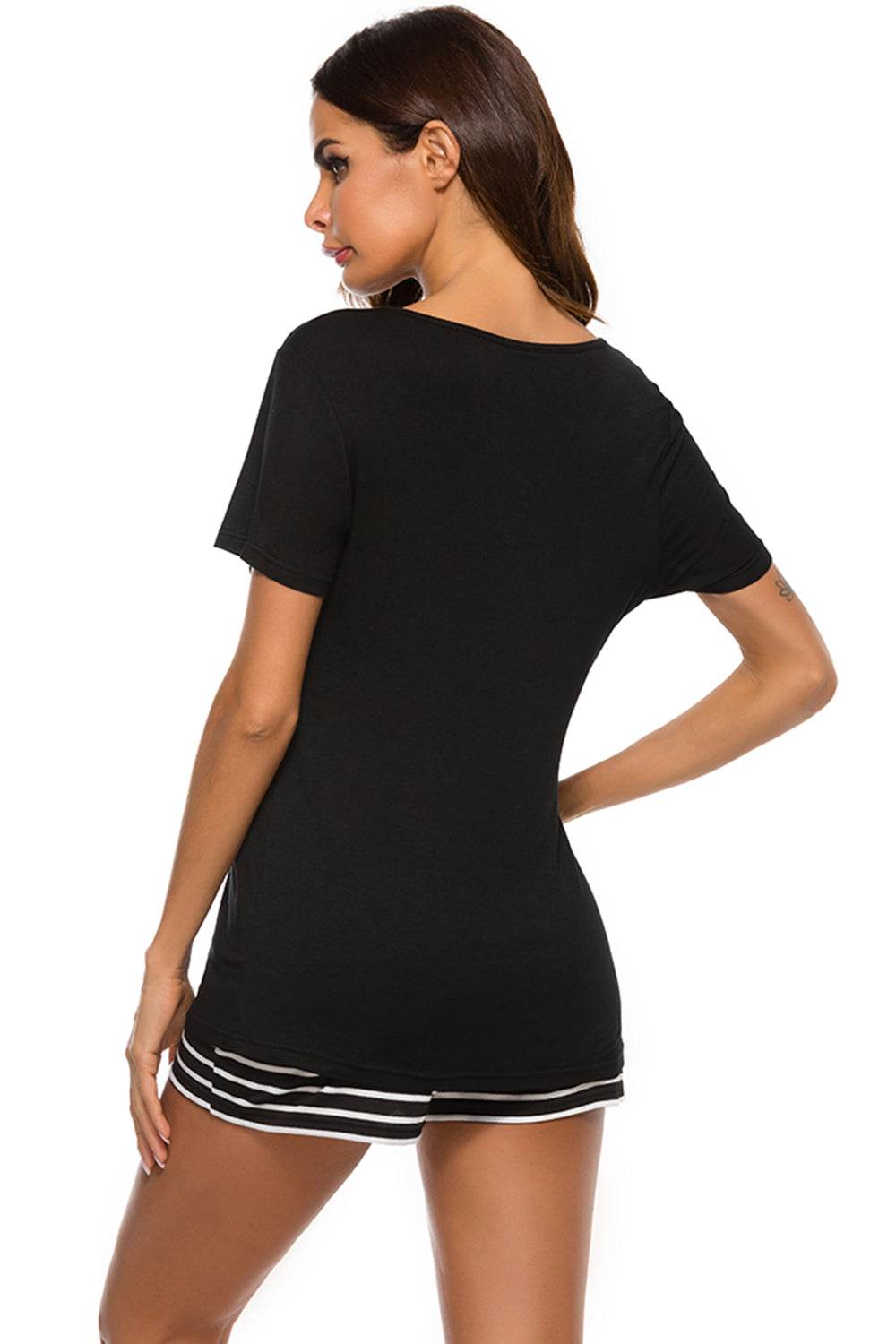 Black graphic round neck top and striped shorts lounge set with short sleeves, made of stretchy rayon and spandex.