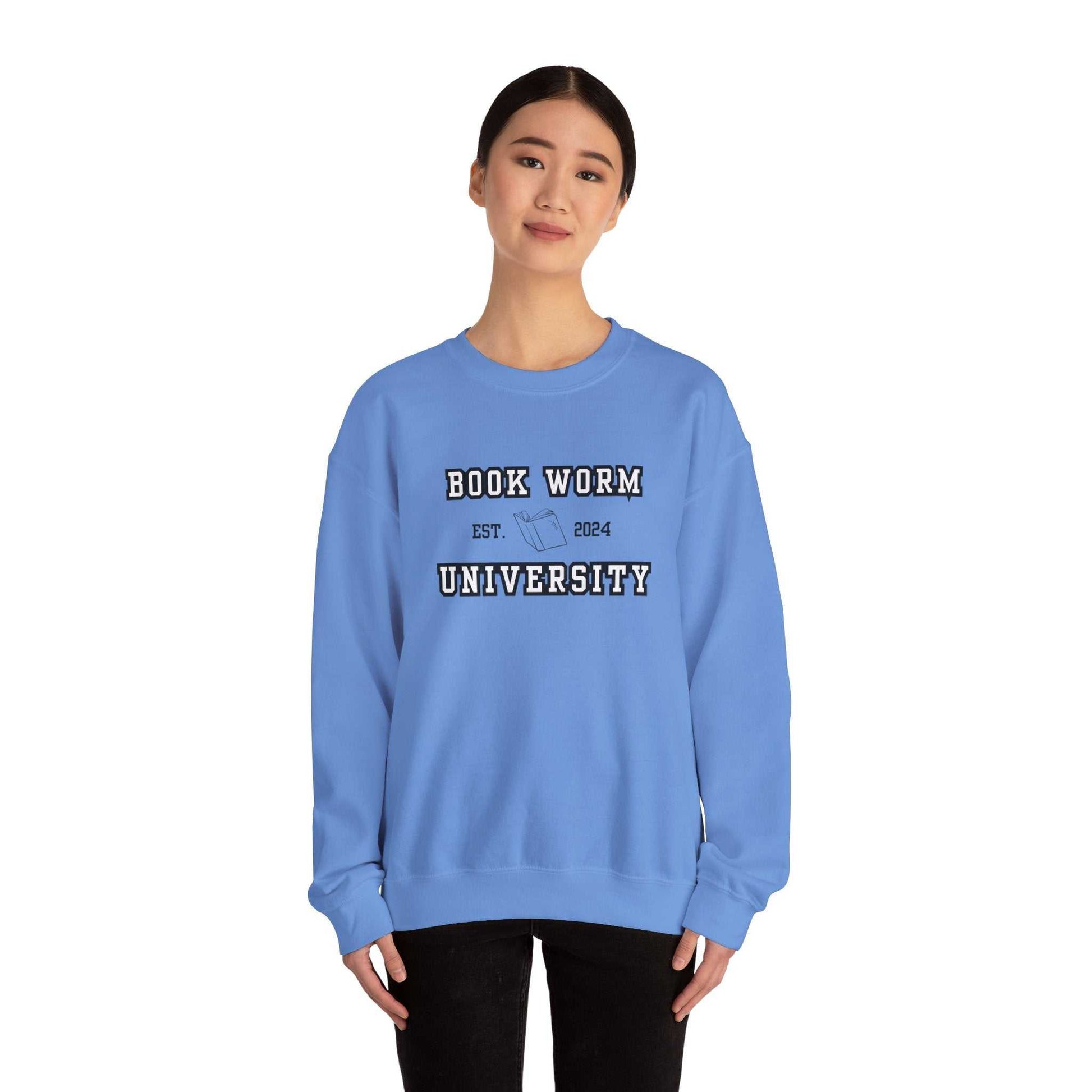 Bookworm University Crewneck Sweatshirt - Est 2024 Design in blue with a book graphic, cozy cotton-polyester blend, classic fit, ideal for book lovers.