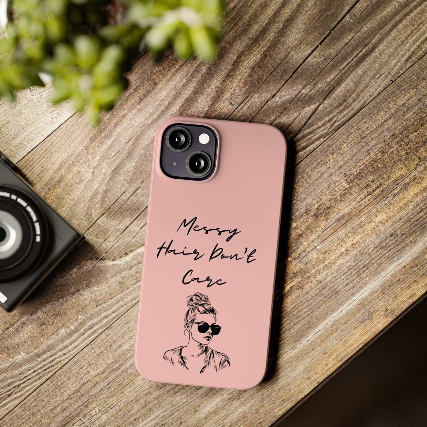 Baby pink phone case with "Messy Hair, Don't Care" quote and girl with messy bun and sunglasses.