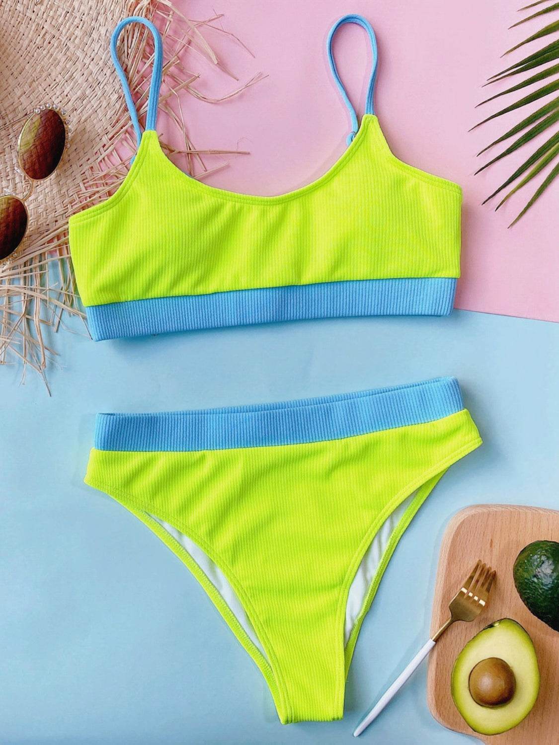 Two-piece swim set with scoop neck and spaghetti straps in bright yellow and blue, featuring removable padding and stretchy fabric.