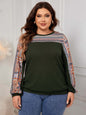 Plus size printed long sleeve sweatshirt in green with patterned sleeves.