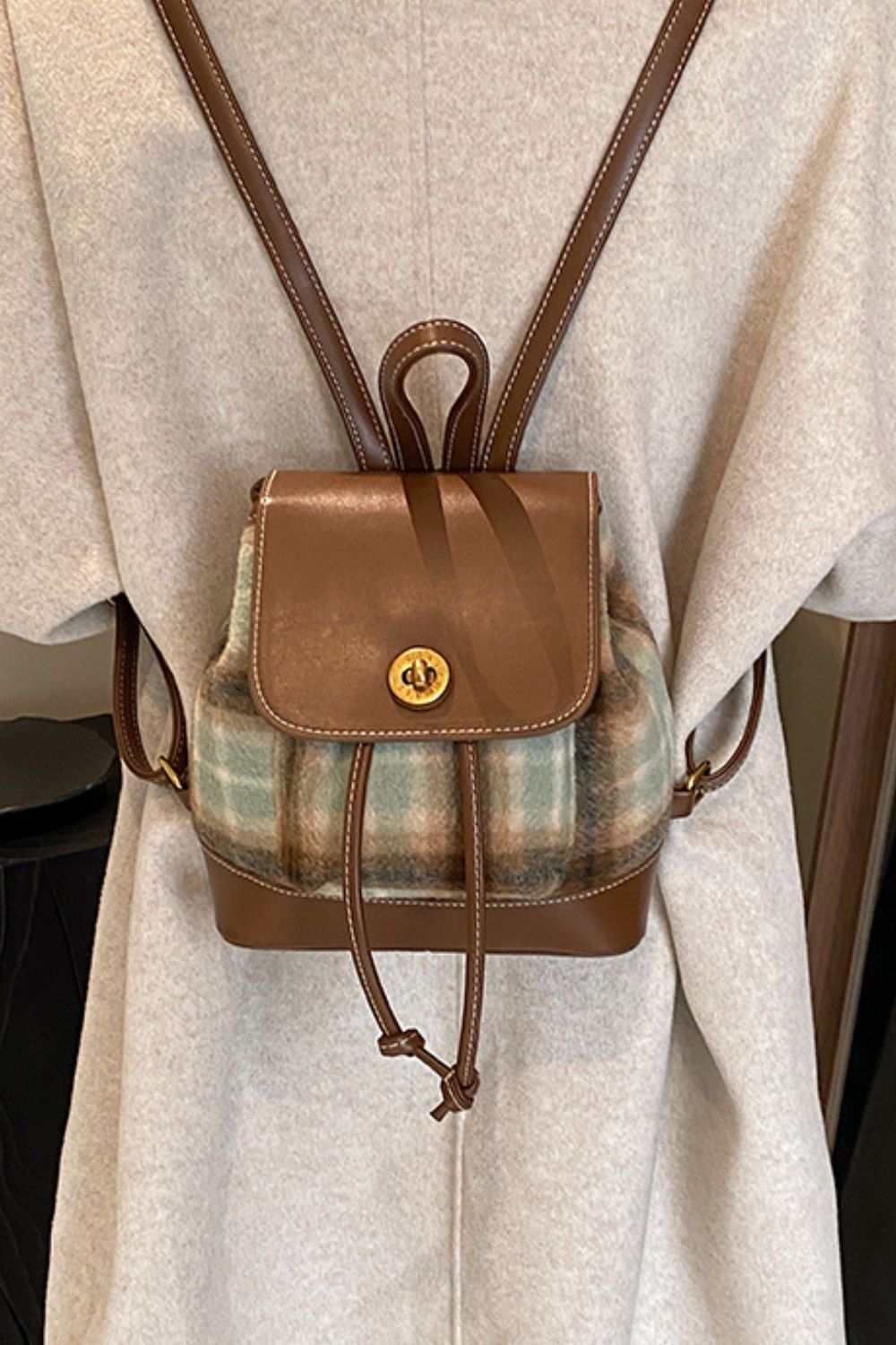 Small PU leather drawstring plaid backpack bag with brown straps.