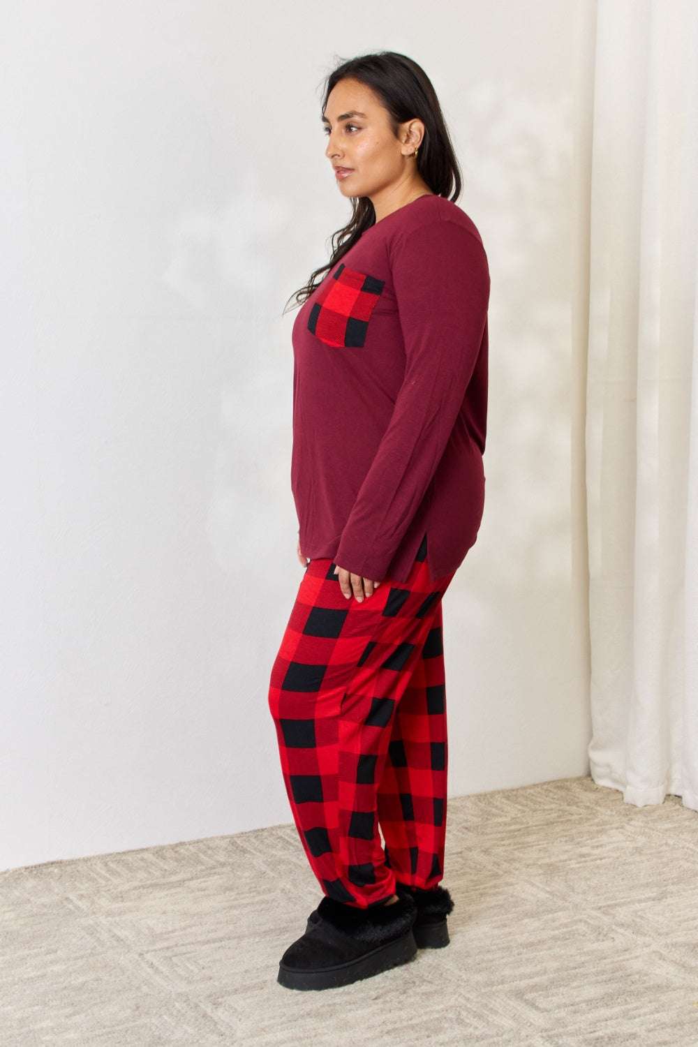 Plaid round neck top and pants pajama set with front pocket and side slits.