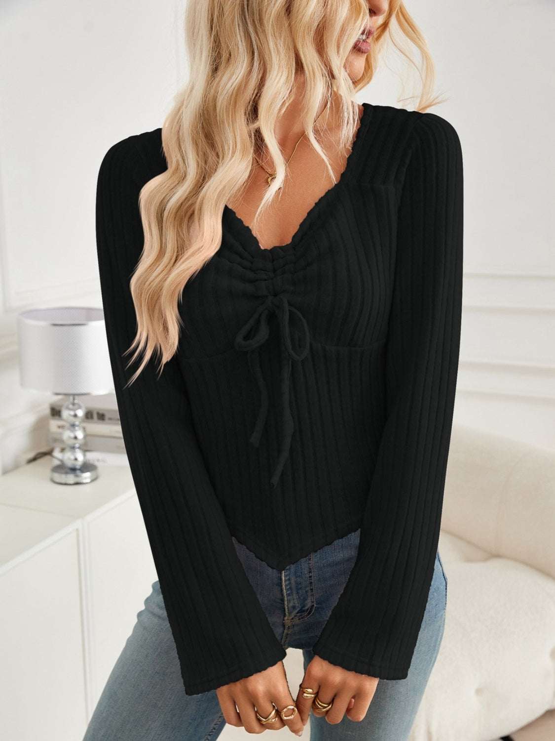 Ribbed drawstring long sleeve t-shirt in black, featuring a slightly stretchy fit.