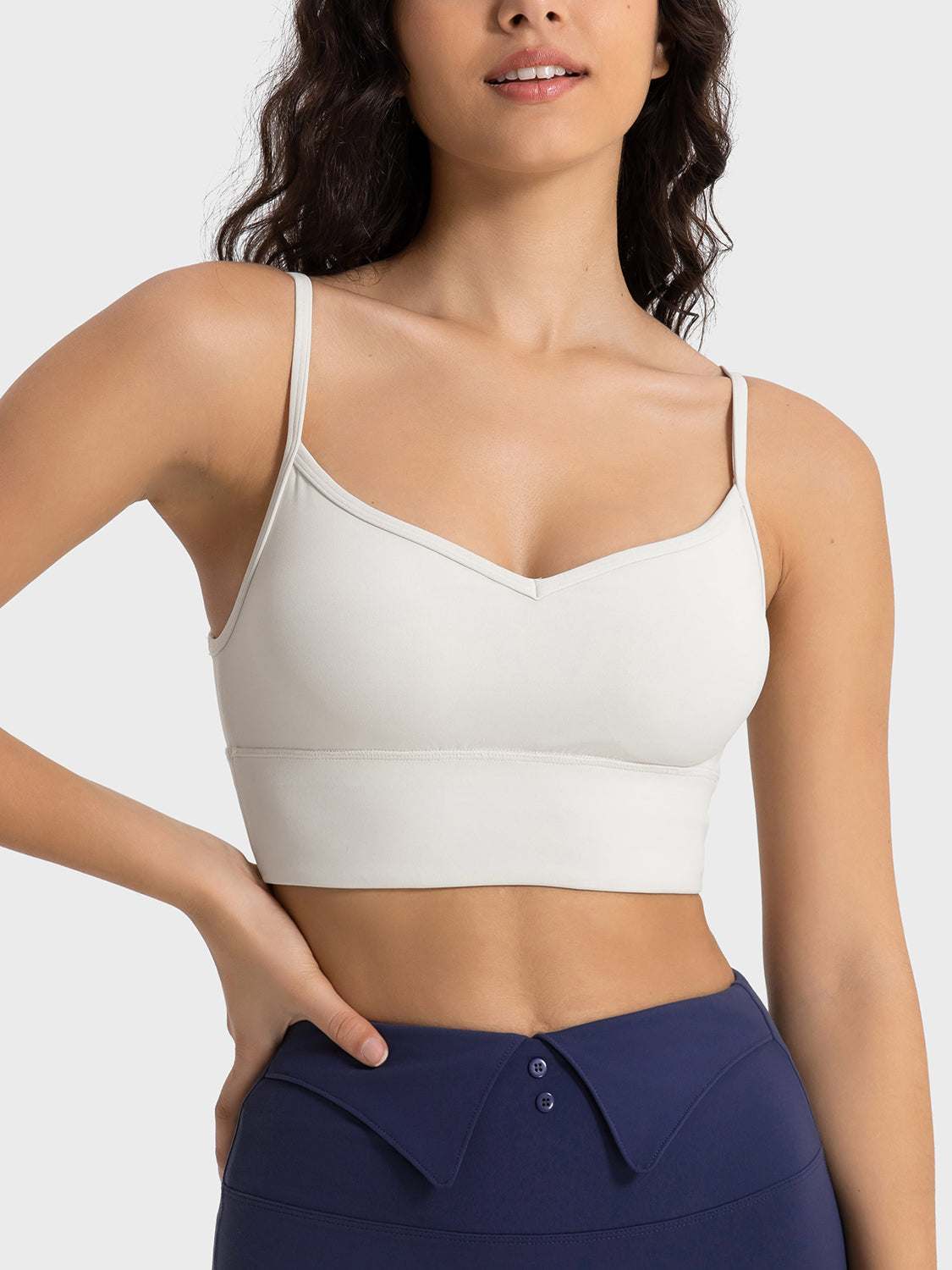 Millennia Spaghetti Strap Sport Bra in white with removable padding and stretchy fit.