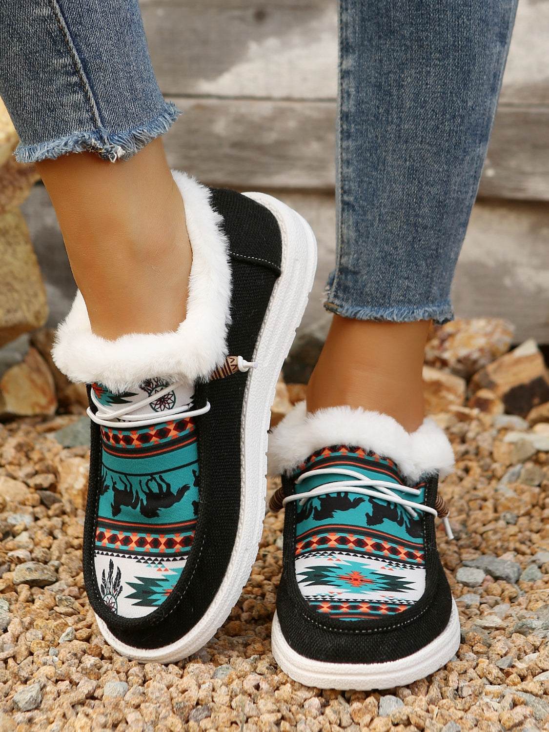 Colorful printed round toe flat slip-ons with faux fur lining.