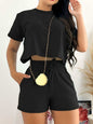 Full size round neck short sleeve top and shorts set in black with pockets and a tied waist.