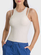 Millennia Cutout Round Neck Racerback Active Tank in beige, moderate stretch, nylon-spandex blend.