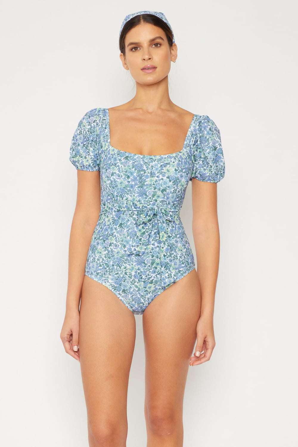 Blue floral Marina West Swim one-piece with puff sleeves and square neckline.