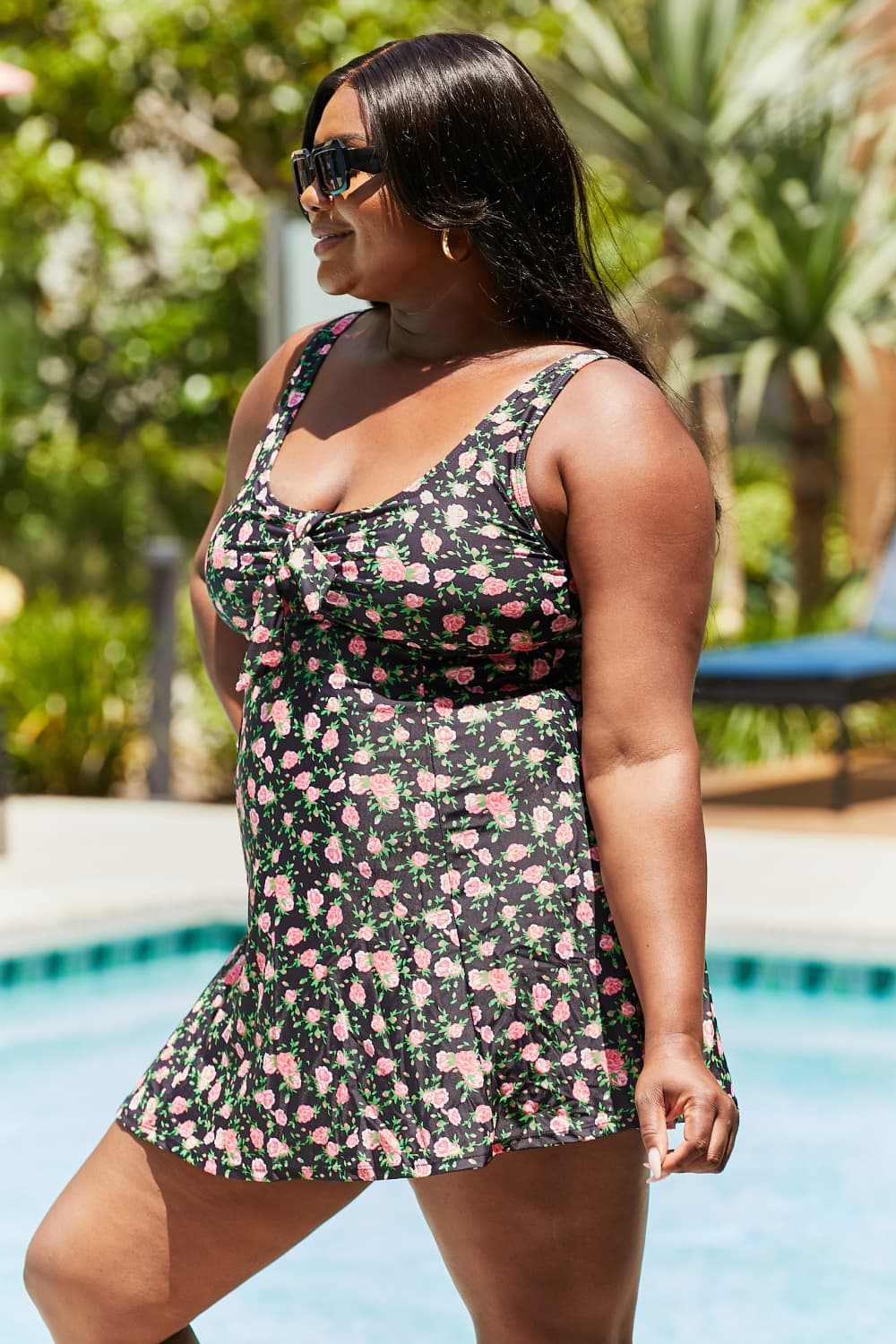 Marina West Swim Full Size Clear Waters Swim Dress in Black Roses with floral pattern and ruffle features.