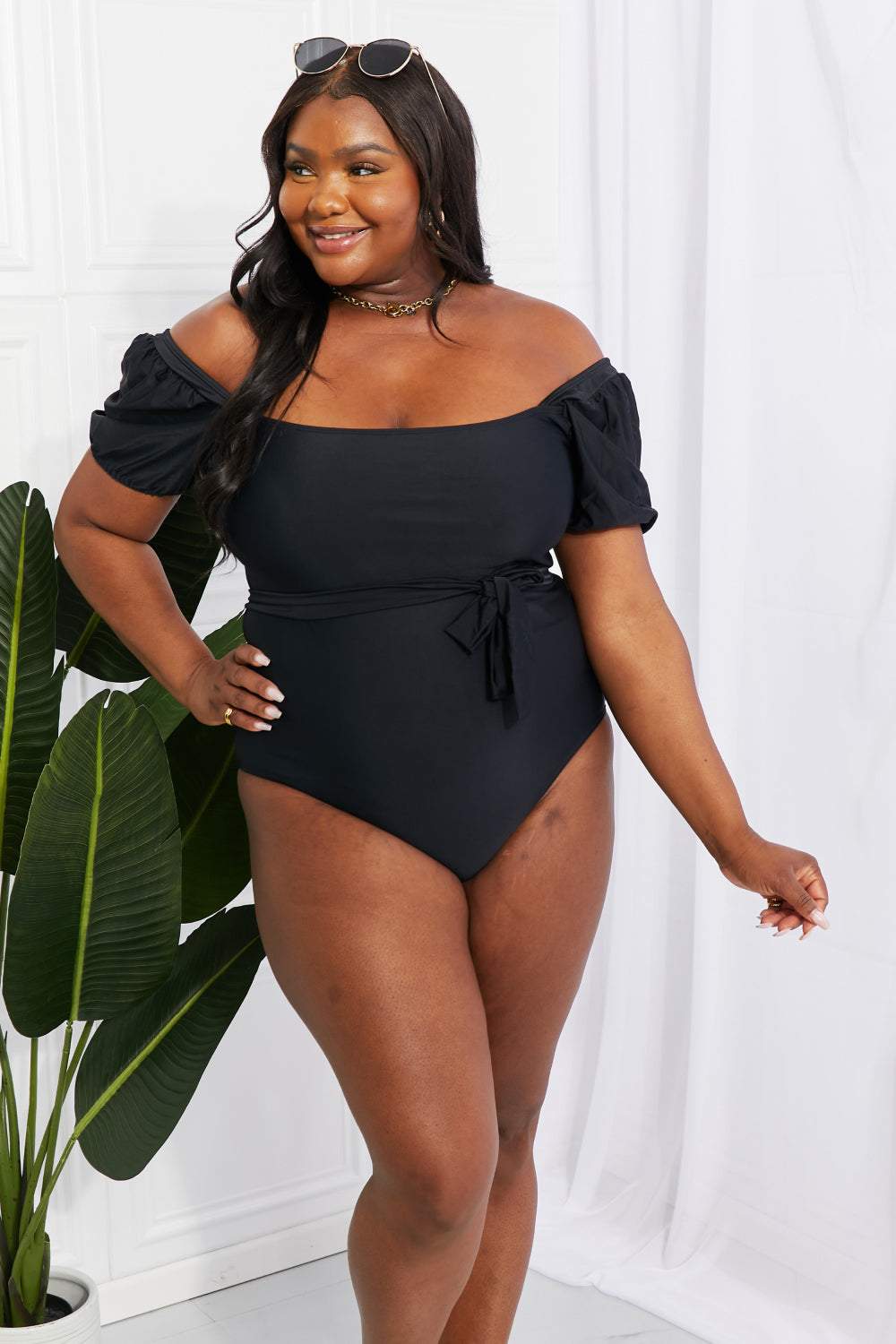 Marina West Swim Salty Air Puff Sleeve One-Piece in Black with puff sleeves and optional tie belt.