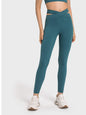 Millennia Crisscross Cutout Sports Leggings in teal, stretchy nylon-spandex blend.