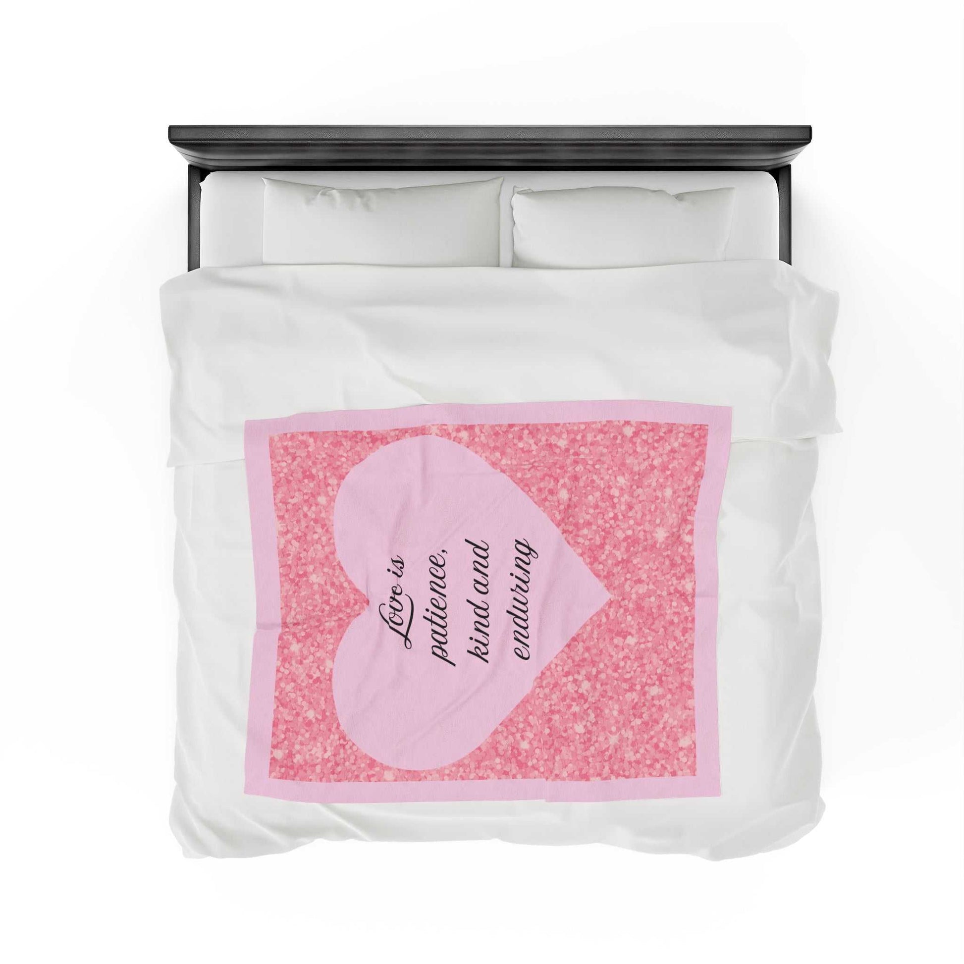 Plush blanket with pink heart, "Love is patience, kind and enduring," surrounded by pink glitter design.