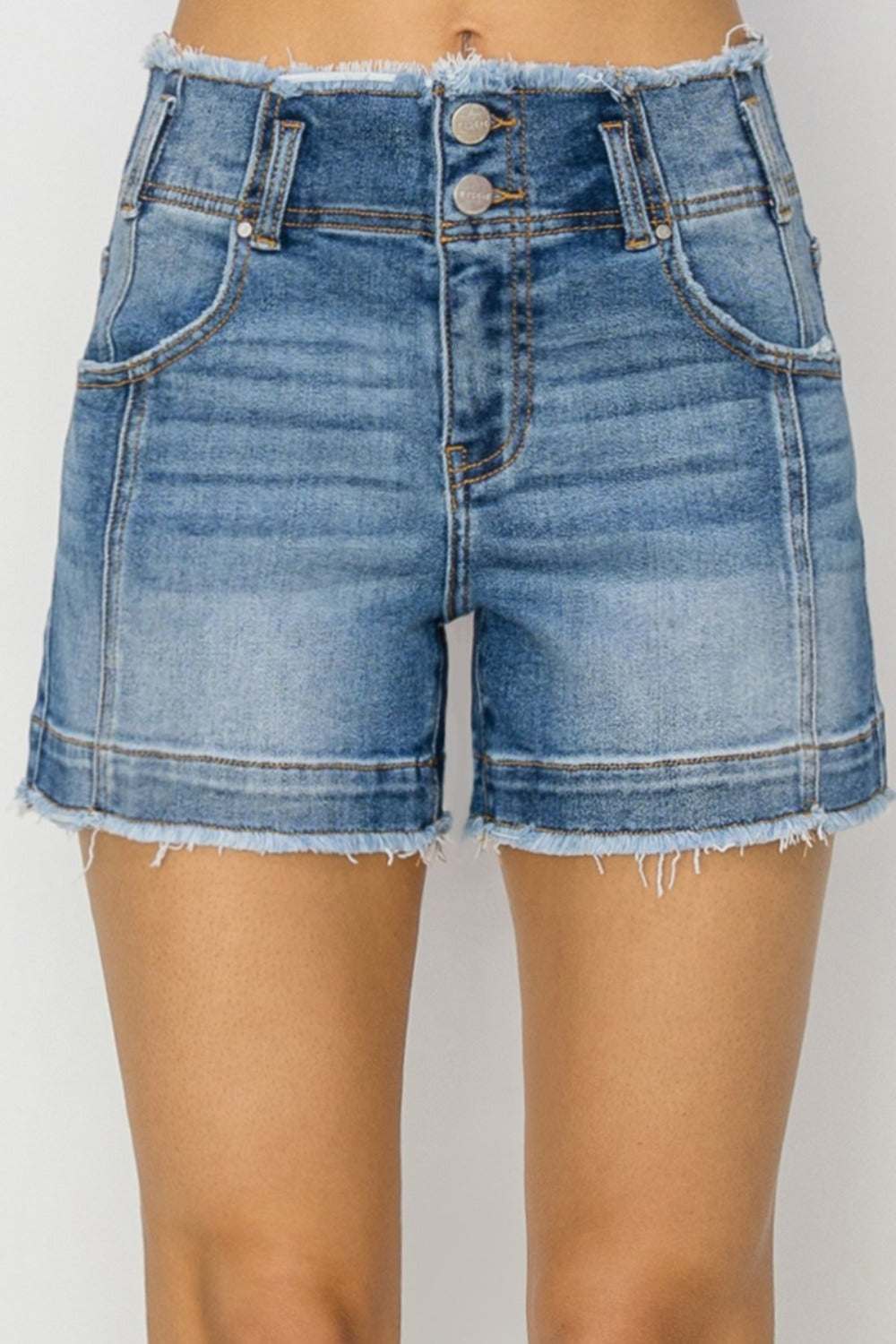 RISEN High Rise Seam Detailed Raw Edge Denim Shorts with pockets and raw hem.