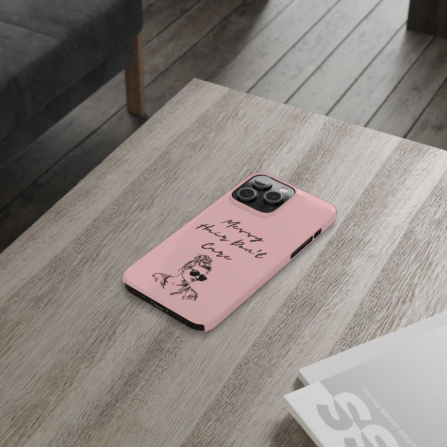 Baby pink phone case with "Messy Hair, Don't Care" quote and stylish girl illustration.