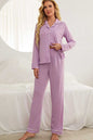 Loungewear set with contrast piping, button-down top, lapel collar, and long sleeves.