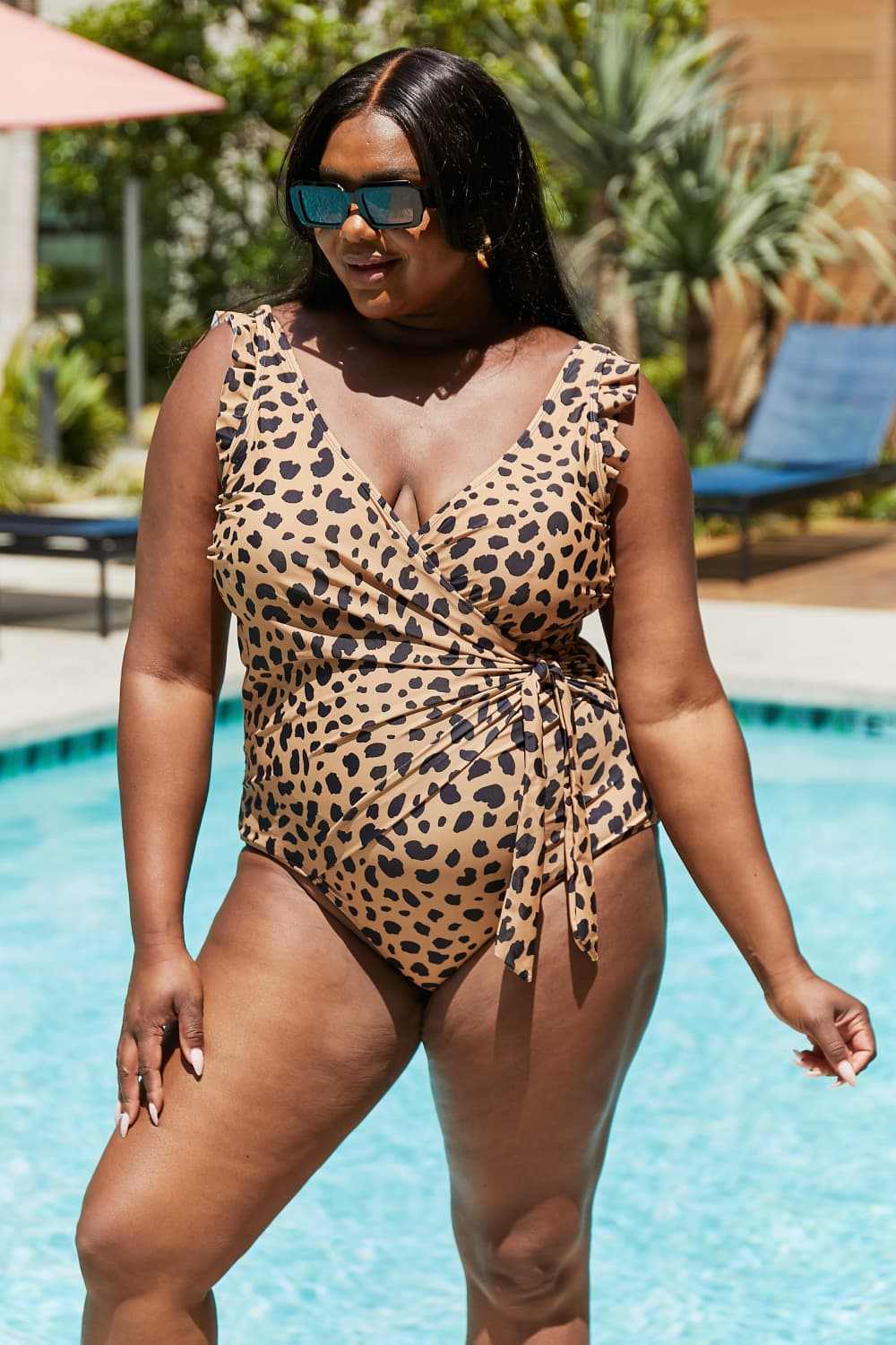 Faux wrap leopard one-piece swimsuit with ruffle details by Marina West Swim.