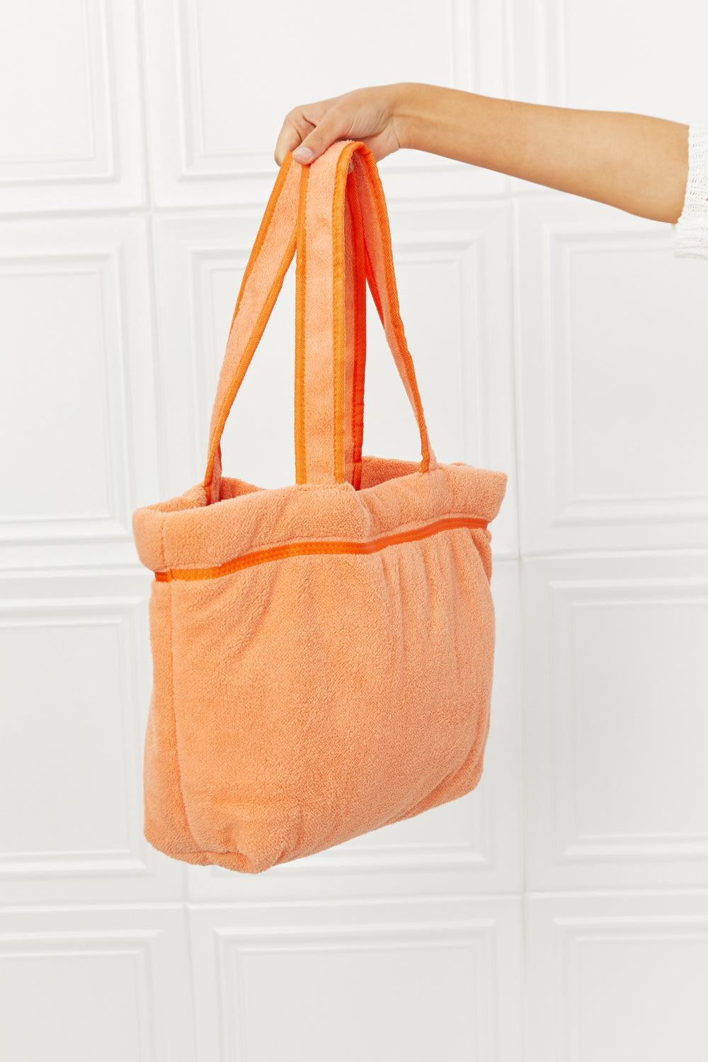 Orange Paradise Tote Bag with soft plush material and spacious design.