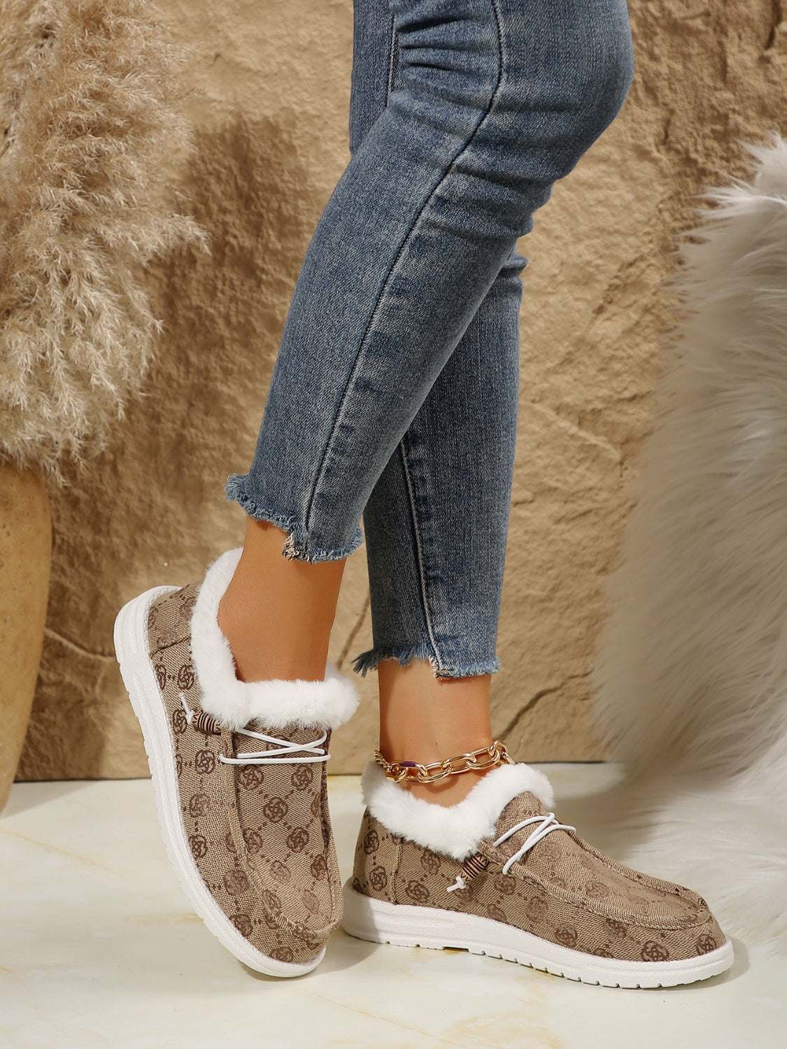 Printed round toe flat slip-ons with faux fur lining and cotton material.