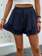 Perfee Tied Layered High Waist Shorts with ruffled design in navy blue, 100% polyester.