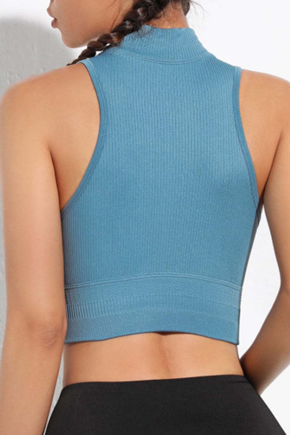 Mock Neck Ribbed Sports Tank in blue with stretchy ribbed material and drawstring feature.