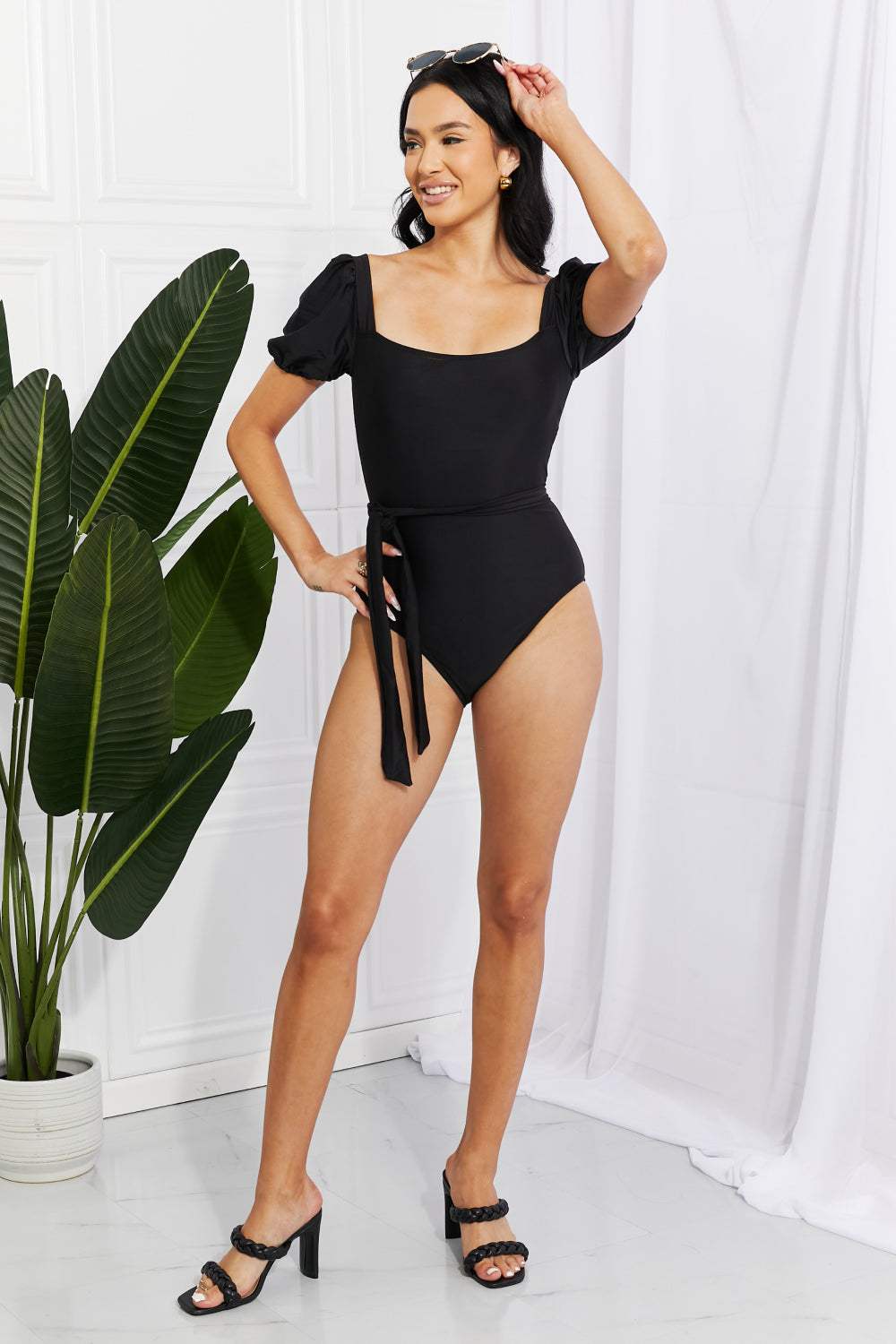 Marina West Swim black one-piece swimsuit with puff sleeves and square neckline.